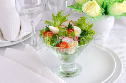 Salad of summer vegetables with quail eggs