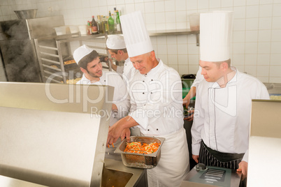 Professional chef cook prepare food in kitchen