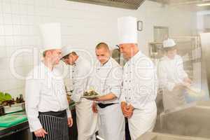Professional kitchen busy team cooks and chef