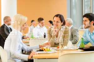 Cafeteria lunch young business people eat salad