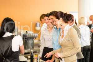 Paying at cafeteria woman cashier serve woman