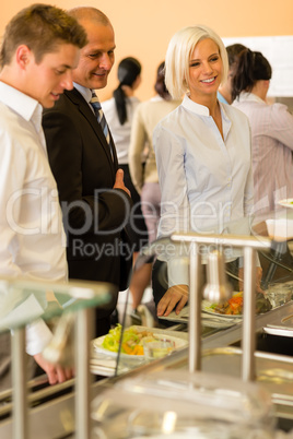 Young business colleagues queue canteen lunch