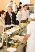 Business colleagues cook serve lunch canteen food