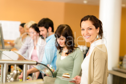 Cafeteria food young woman choose dessert