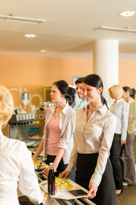 Cafeteria pay at cashier women in queue