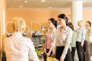 Cafeteria pay at cashier women in queue