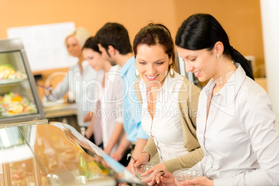 Cafeteria lunch two office woman choose food