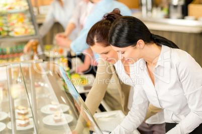 Cafeteria lunch two office woman choose food