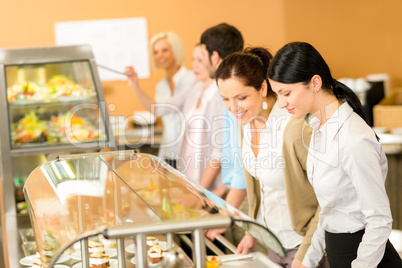 Cafeteria lunch two office woman choose food