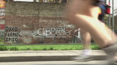 Marathon, legs, graffiti wall
