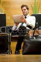 business man waiting in office lobby