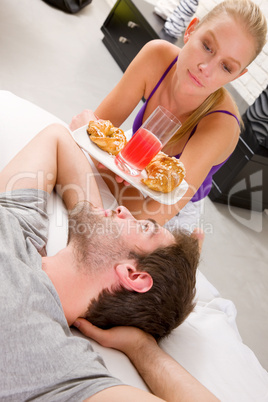 couple having breakfast in bed