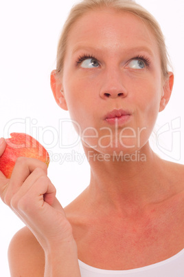 young beautyful caucasian woman eating and holding apple in the