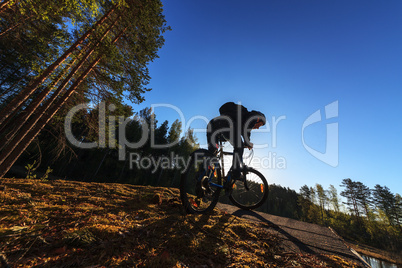 Biker Riding in Forest