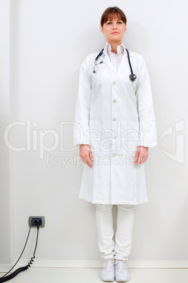 portrait of a young caucasian woman doctor standing