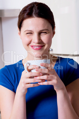 woman drinking a cup of tea