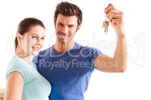 couple with the keys of the new home