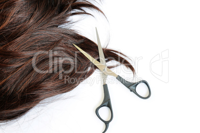 Brown hair and scissors