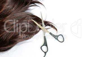 Brown hair and scissors