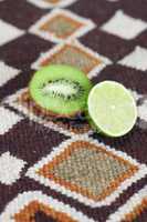 kiwi and lime on ethnic mat