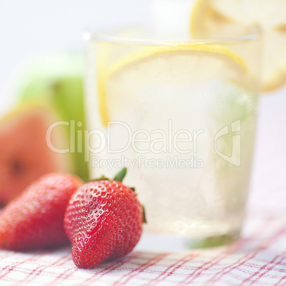 cocktail with ice,lemon, fig,apple and strawberries