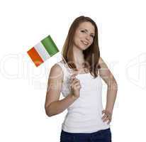 Attractive woman shows flag of Ireland and smiles in front of white background