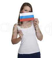Attractive woman hides her face behind flag of Russia