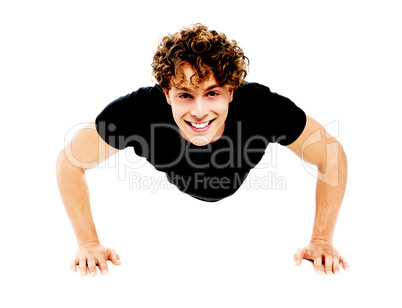 Healthy young guy doing push-ups