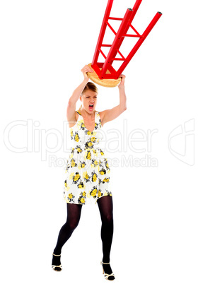 Frustrated woman breaking stool