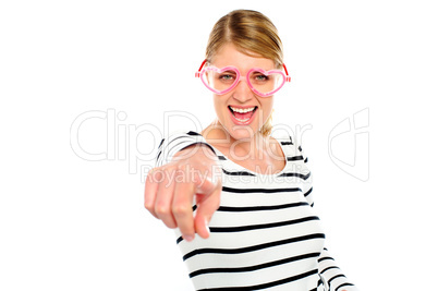 Excited woman pointing at you