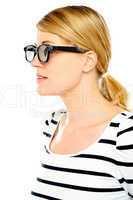 A young beautiful woman wearing sunglasses