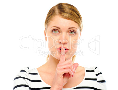Female with wide open eyes gesturing silence