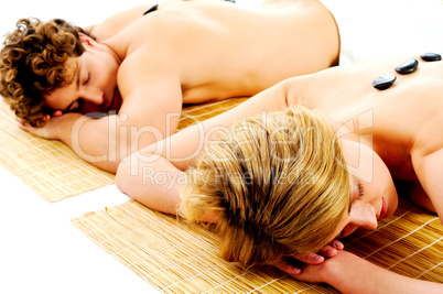 Merry young couple enjoying back massage