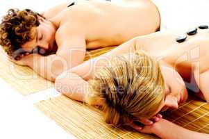 Merry young couple enjoying back massage