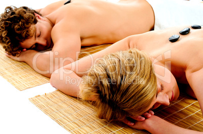 Young couple enjoying spa treatment