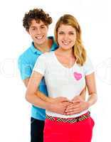 Smiling young couple standing together