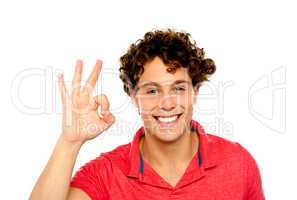 Curly hair guy gesturing excellence sign