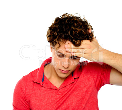 Stressed out guy with hand on his forehead