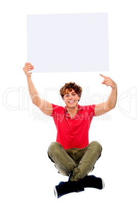 Cool guy pointing towards white blank billboard