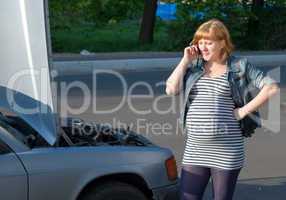 Pregnant Woman Calling for help near the Broken Car