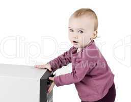 young child playing with cd