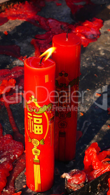 Red prayer candles