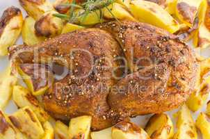 chickens roast with baking potatoes