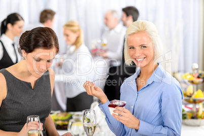 Business meeting buffet smiling woman eat dessert