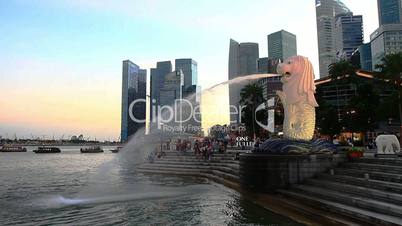 Singapore cityscape at sunset, with city symbol - lion fountain