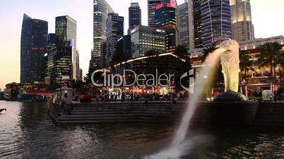 Singapore downtown panorama at sunset, with city symbol - lion fountain