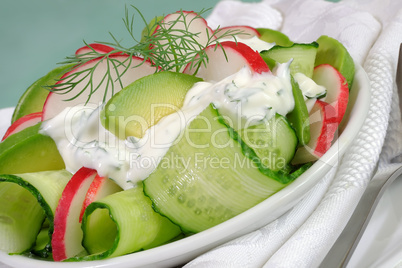 Cucumber salad with radish and avocado cream sauce