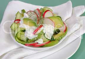Cucumber salad with radish and avocado cream sauce