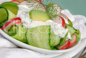 Cucumber salad with radish and avocado cream sauce