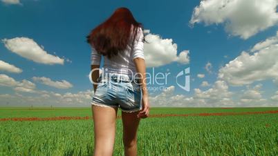 Young Woman In A Green Wheat Field